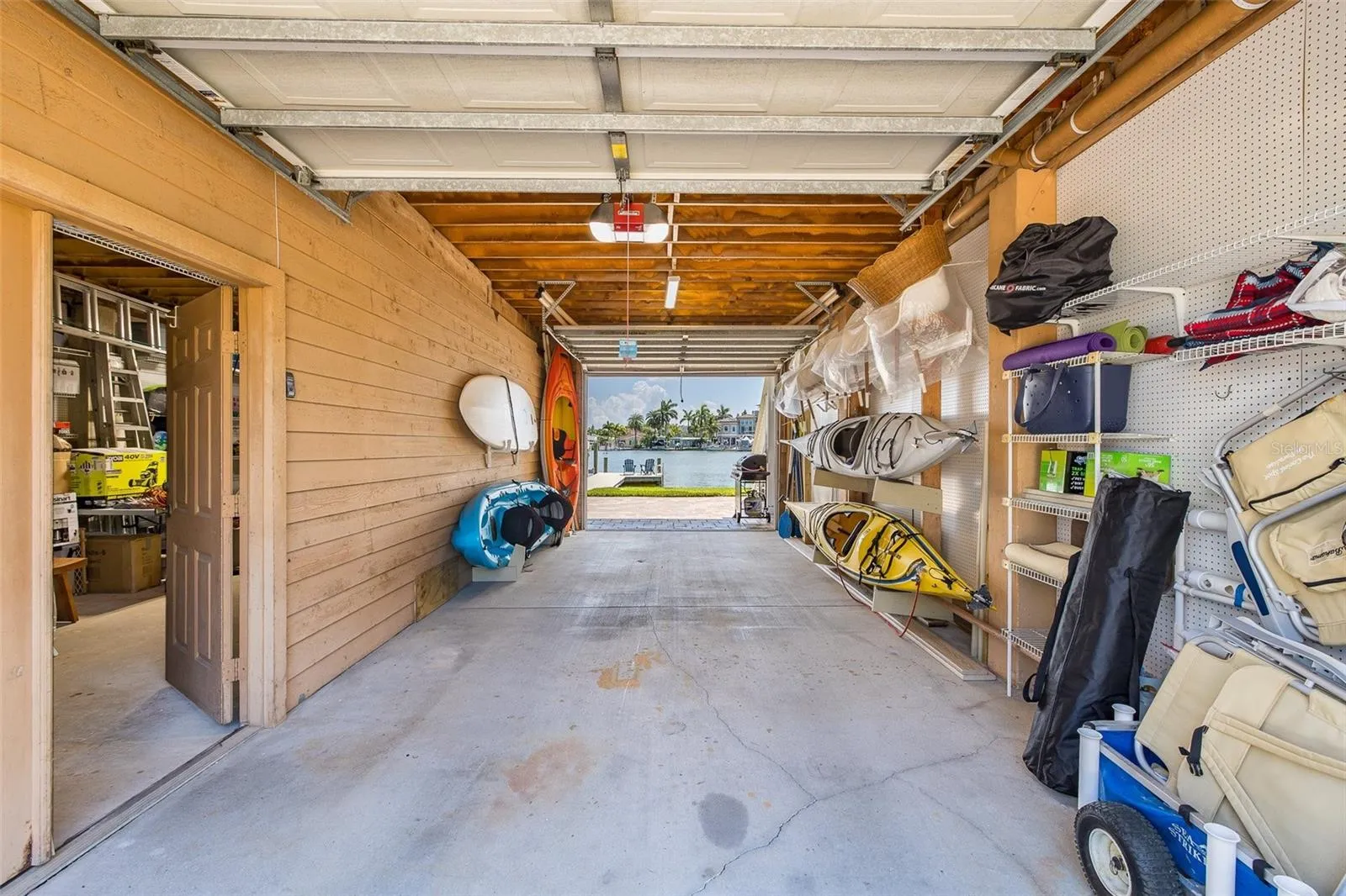 Garage with backyard access plus large storage/workshop room