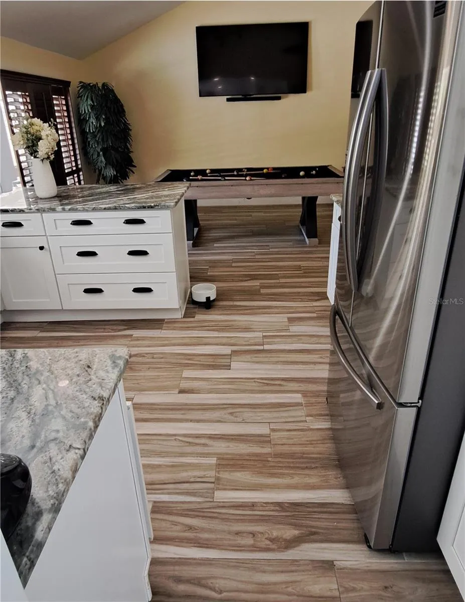 From dining room entering kitchen