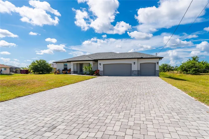 Outside View of Home with Pavered Driveway