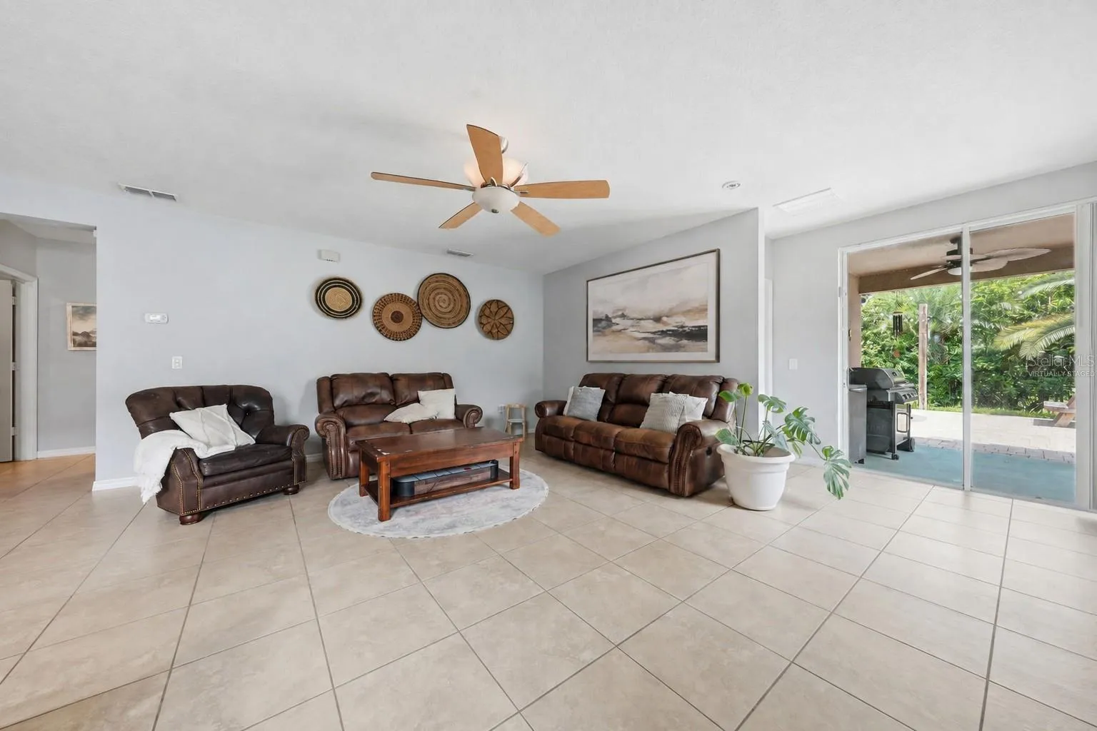 Sliding doors leading to your backyard oasis. Virtually staged wall art