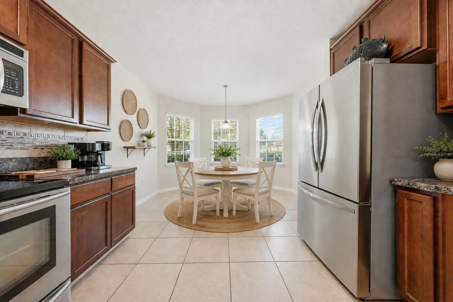 Bright eat -in kitchen.Dinette is virtually staged