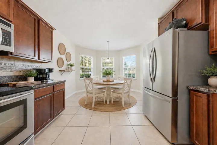 Bright eat -in kitchen.Dinette is virtually staged
