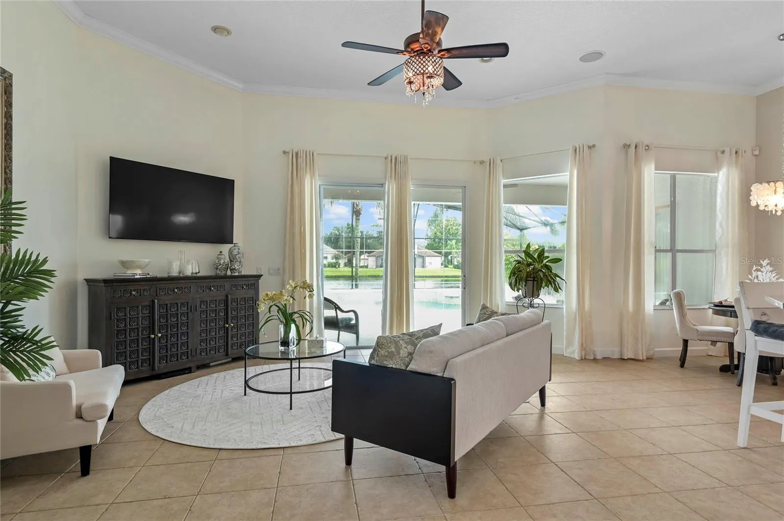 great room towards pool with 12ft ceiling and crown molding