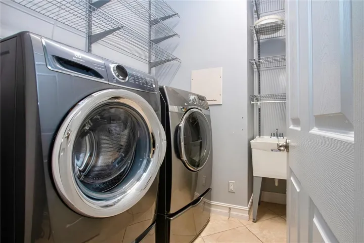 Inside Utility Room w/laundry tub & lots of storage