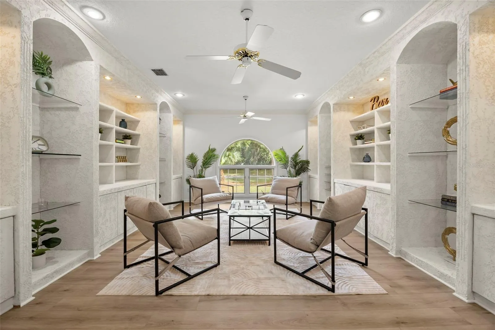 Formal living room with built in shelving and new LVP flooring