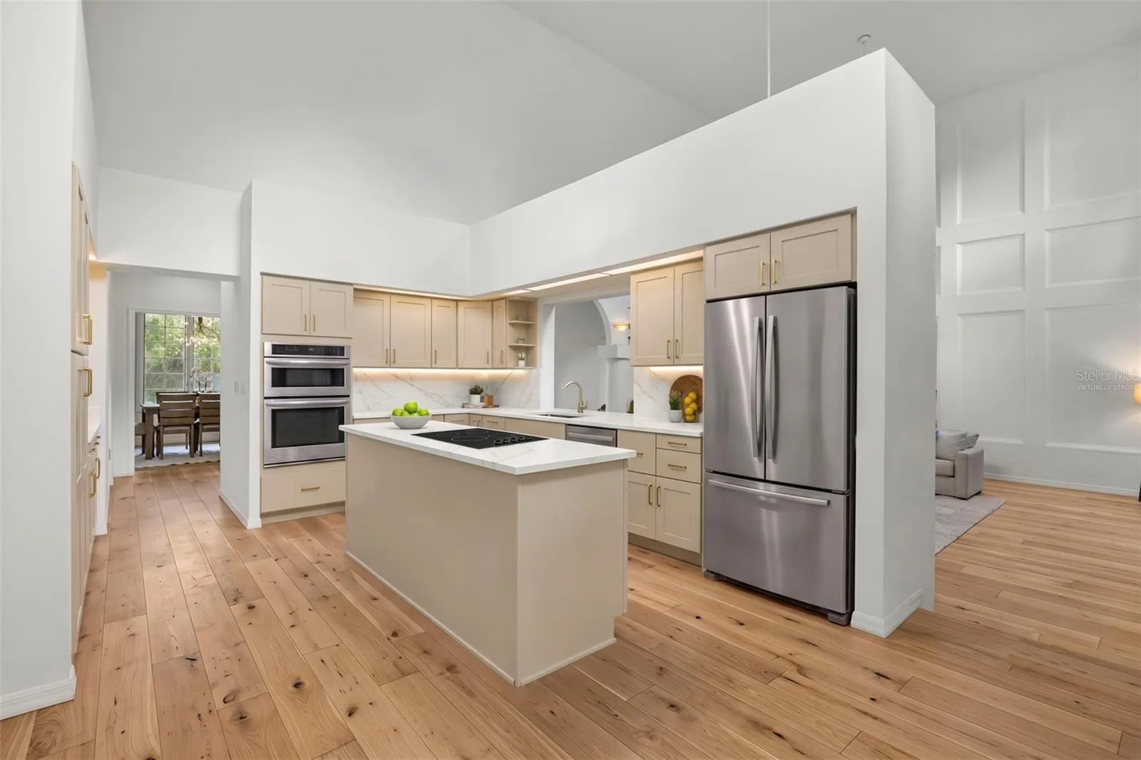 Virtually staged kitchen and continuous flooring. There's so much space to create your dream kitchen!