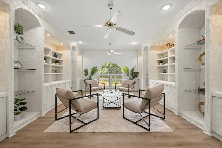 Formal living room with built in shelving and new LVP flooring