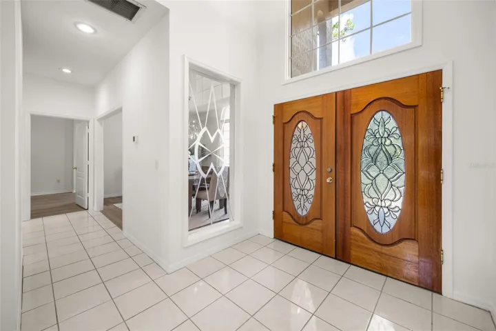 Grand foyer and double entry solid wood doors