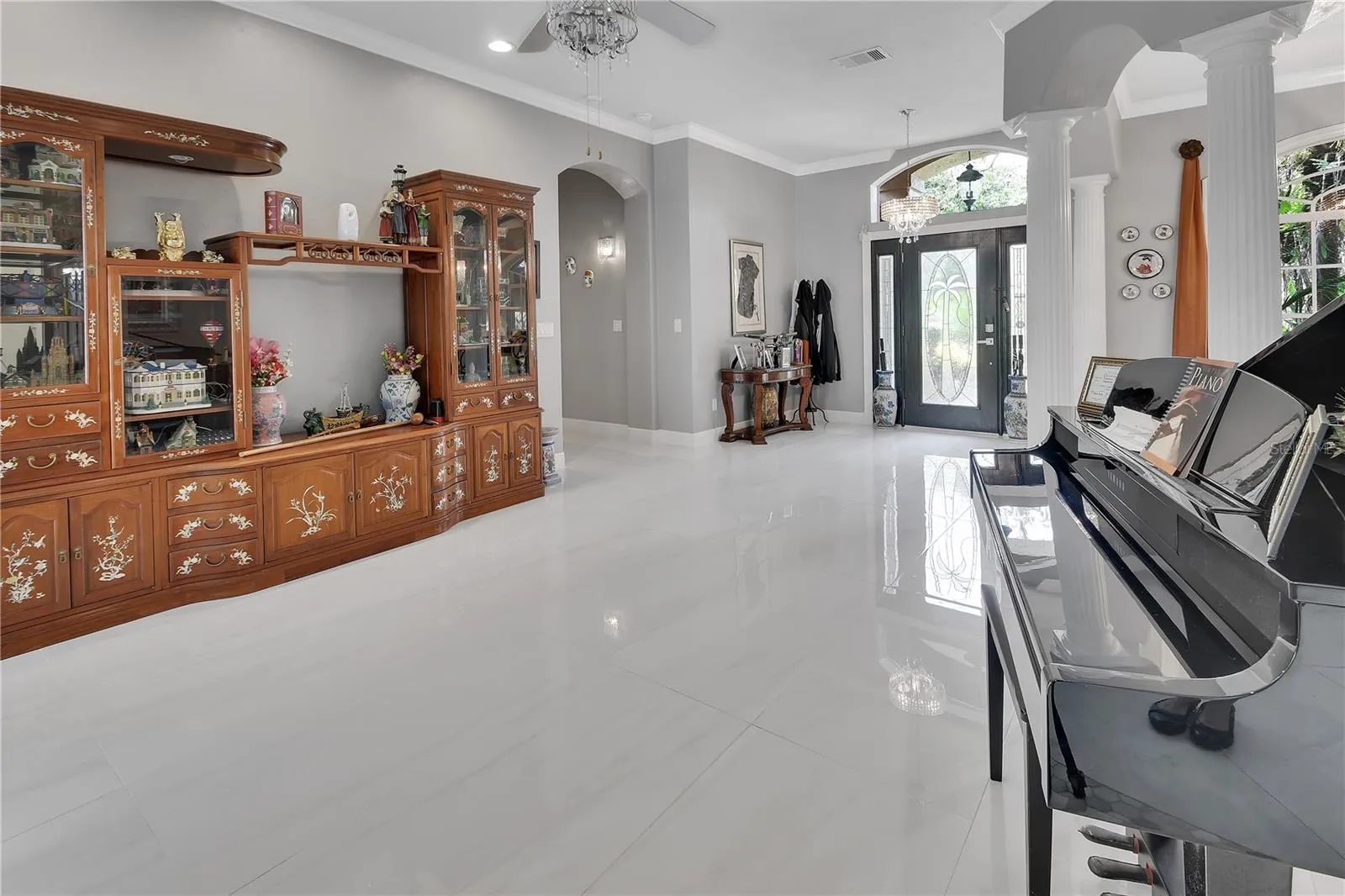 VIEW OF LIVING ROOM AND ENTRY
