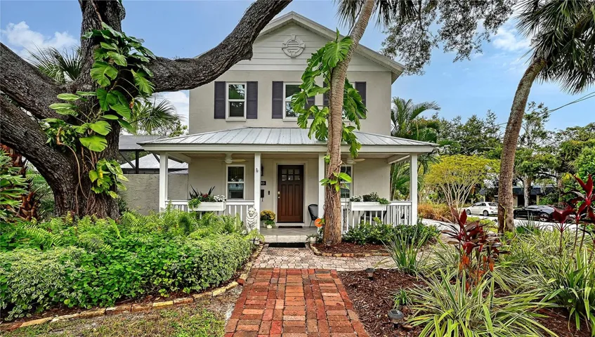 This beautifully renovated, Key West–inspired 4-bedroom, 2938 sf pool home welcomes you