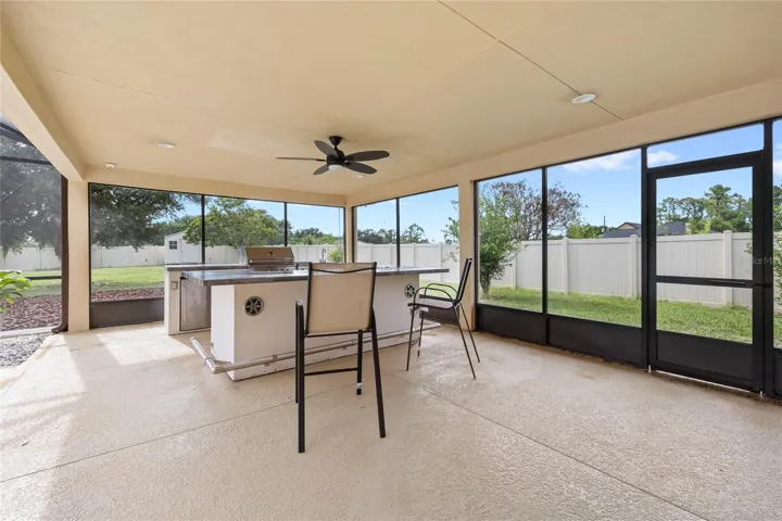 Summer kitchen. Propane grill and refrigerator