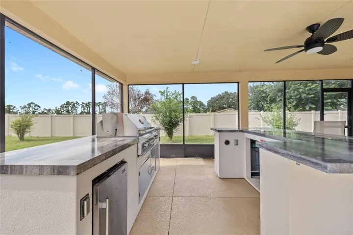 Summer kitchen. Propane grill and refrigerator