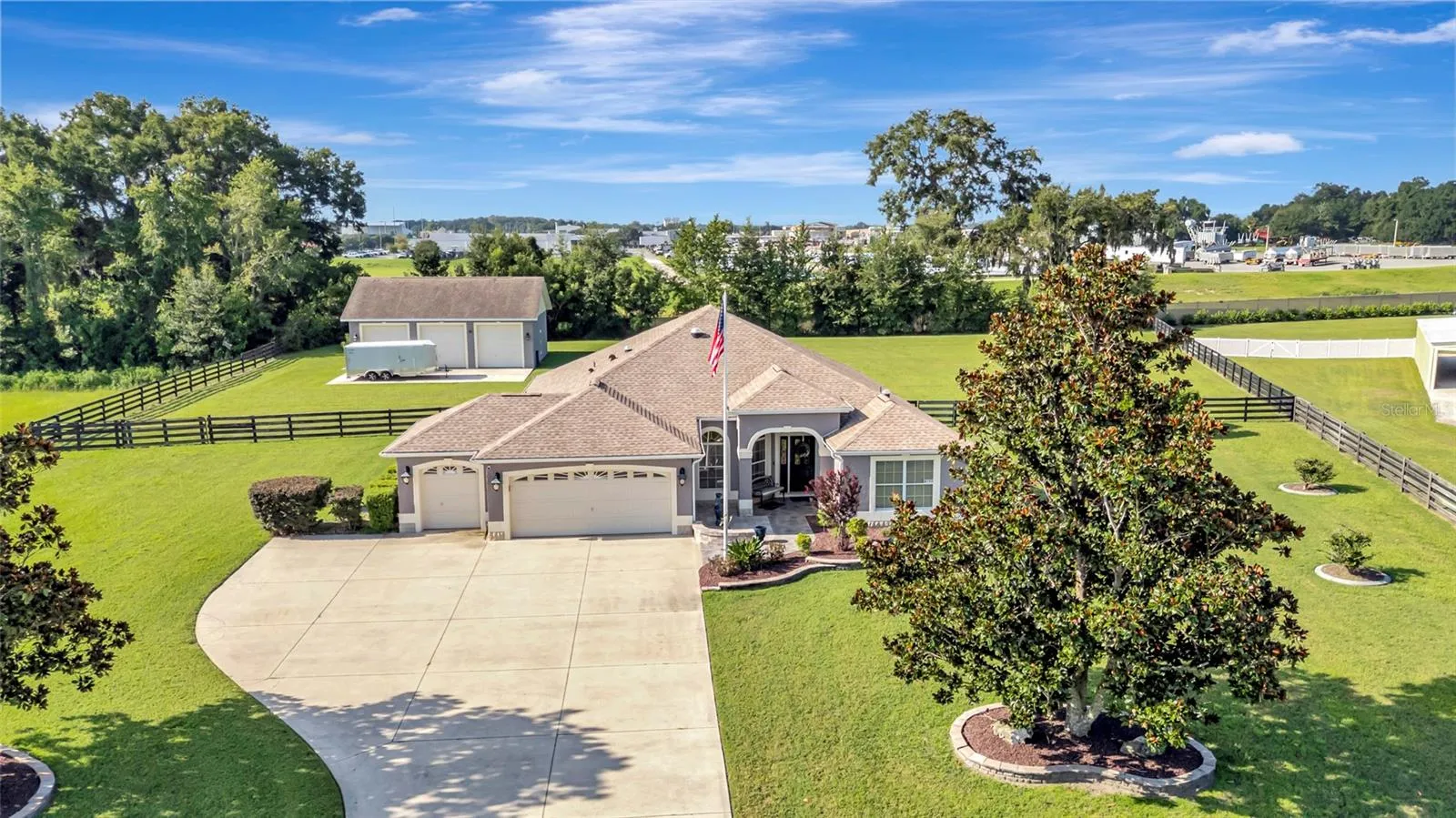 3-Tall Bay separate garage with a totally fenced in back yard!!