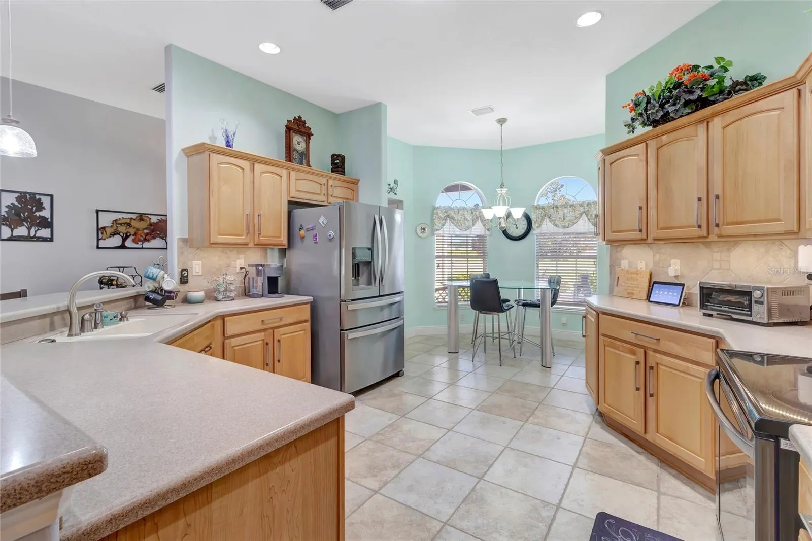 Updated appliances and electric flat surface stove.