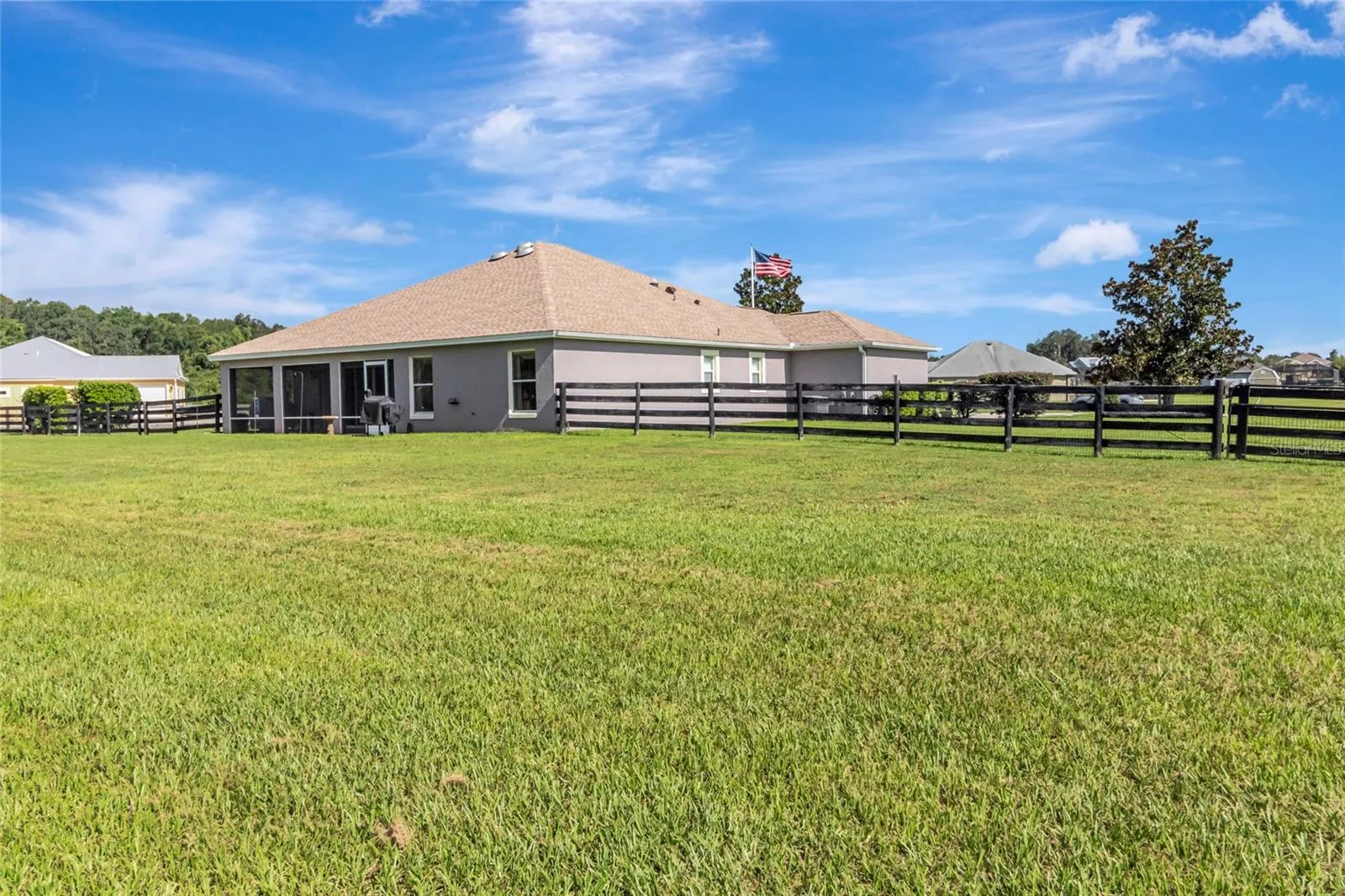 Gate for easy access to the garage out behind the home.  You will be the envy of your neighbors with this garage!!