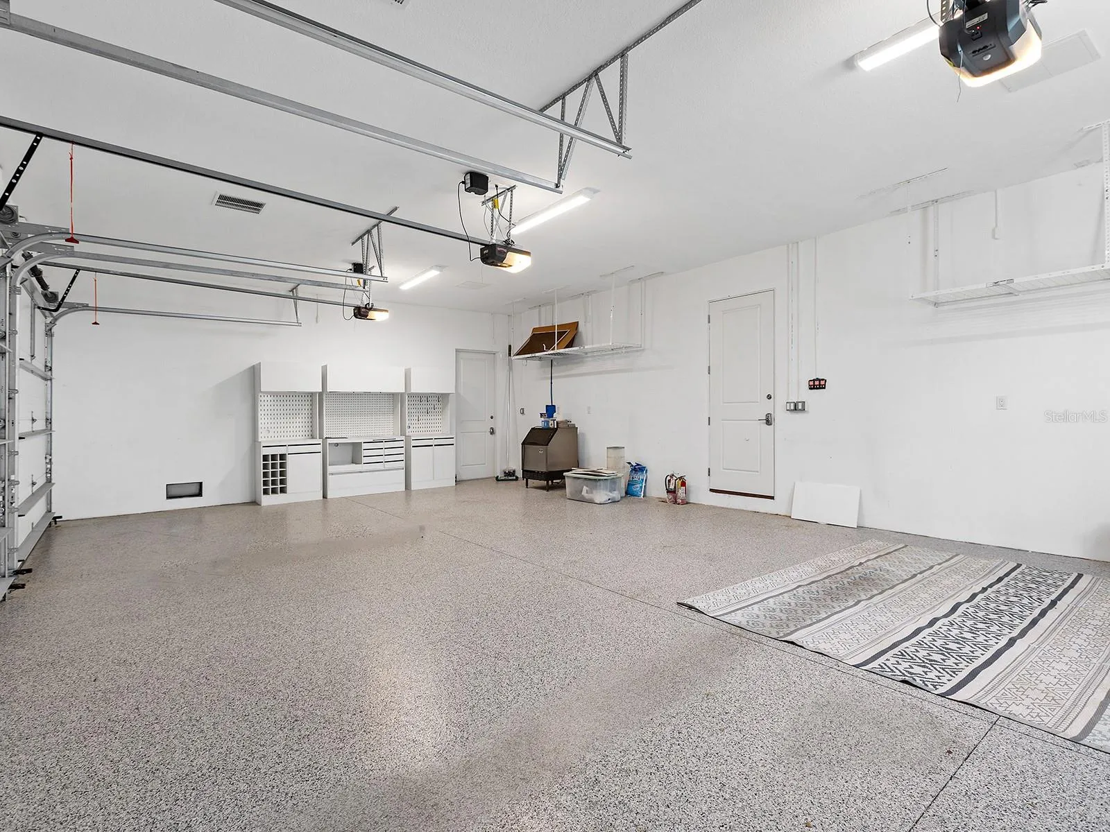 Immaculate garage with epoxy flooring, topped by a spacious, nearly 800-square-foot interior in-law suite complete with a full bathroom