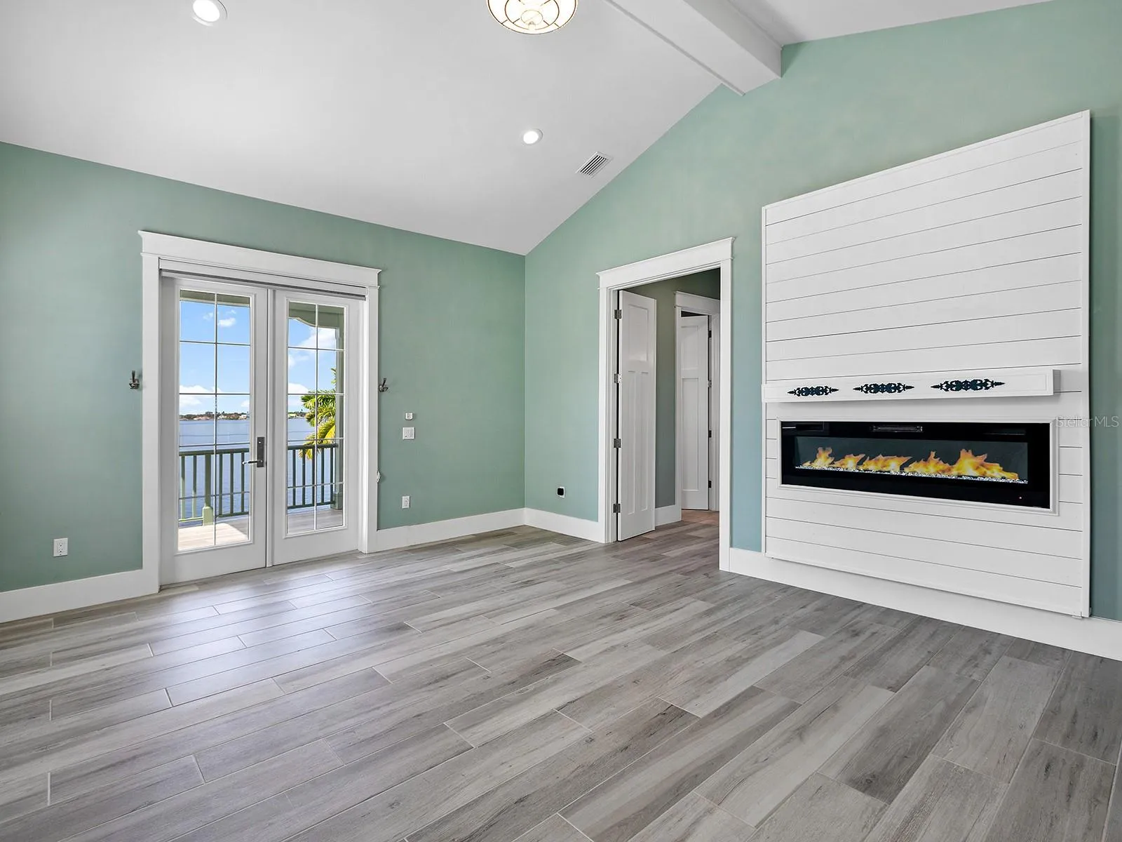 Wake up to panoramic water views and step out onto your expansive covered balcony to enjoy dazzling Gulf views