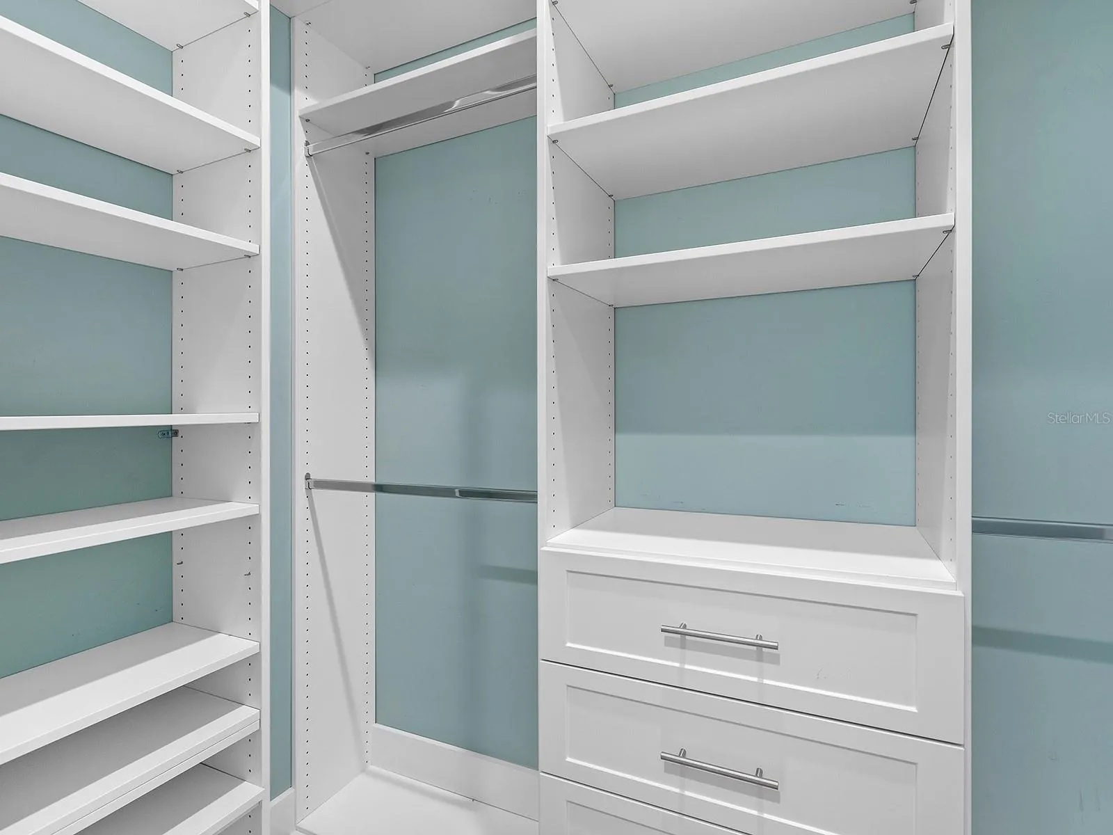 Primary bedroom walk-in closet is all ready