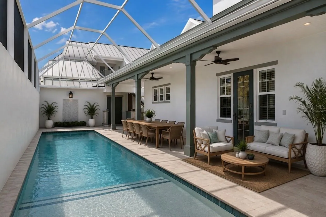 Virtually staged outdoor living oasis featuring spa jets, saltwater caged pool, and access to the ground floor primary bedroom (to the right)