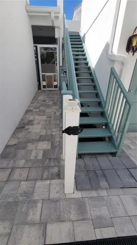 Staircase to in-law suite and door to pool