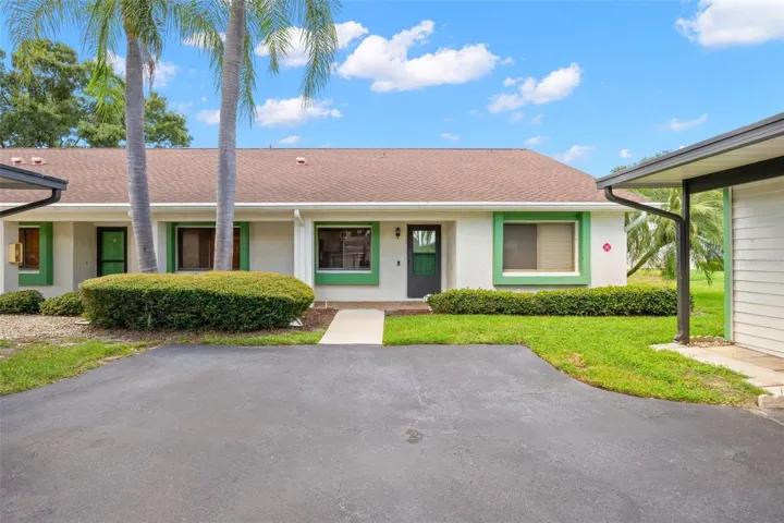 End unit villa, with carport steps from front door.