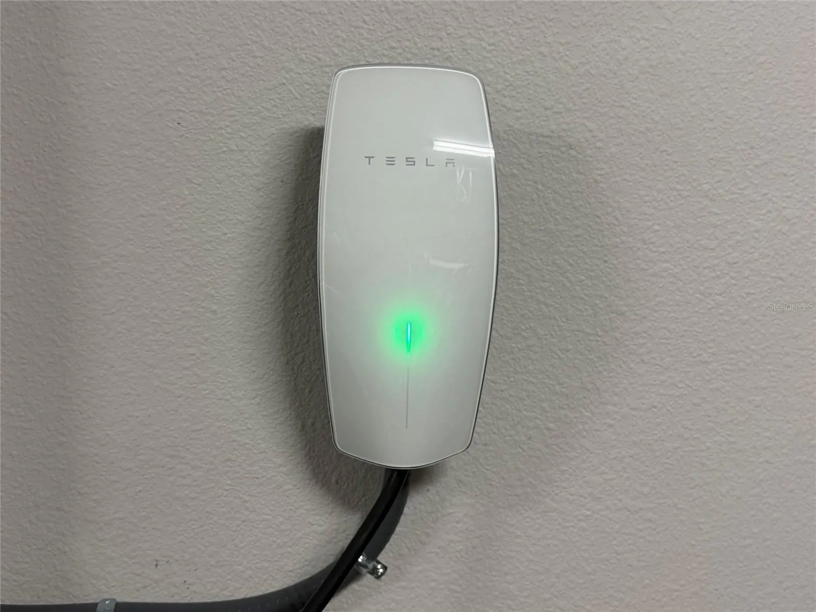 14048 Larkspur Lake Dr - Tesla EV charger included inside the three-car garage.