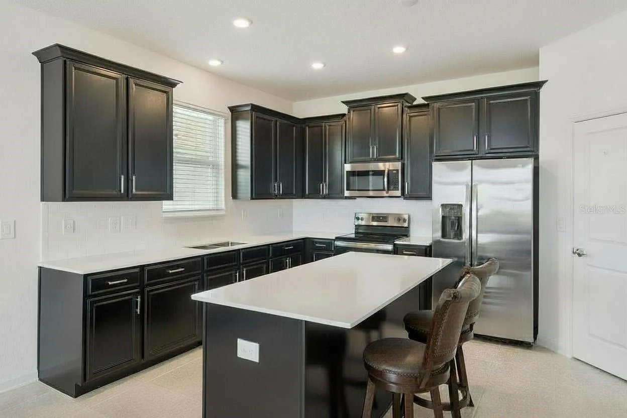 Large Kitchen with Quartz counters and Island