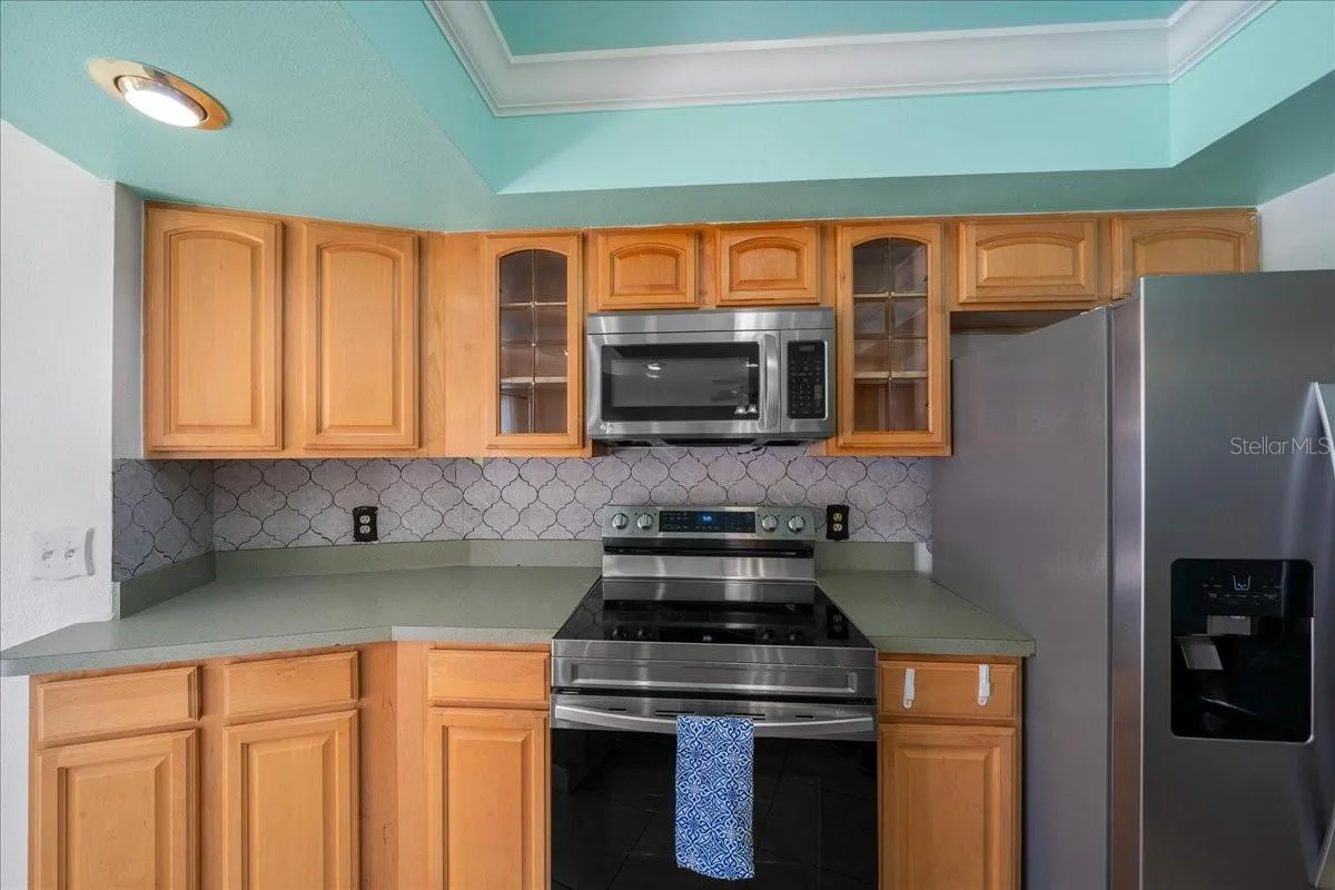 Stainless Steel Stove, Microwave, & Fridge
