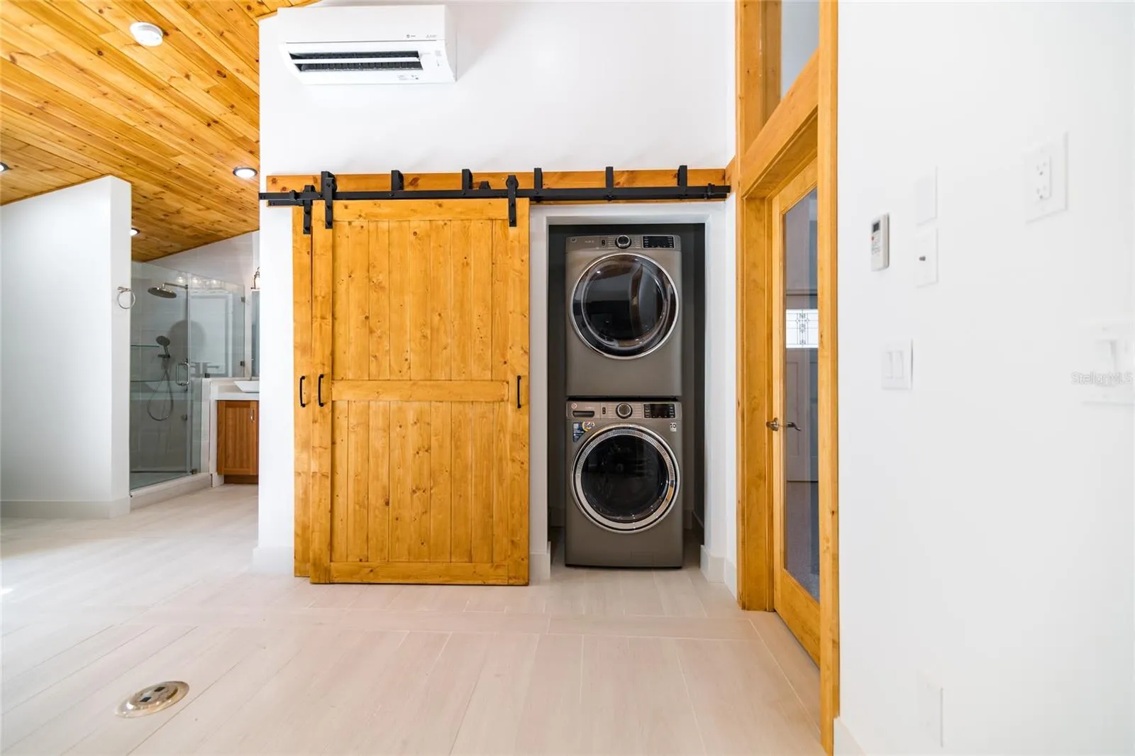 Sliding barn doors with storage and washer/dryer