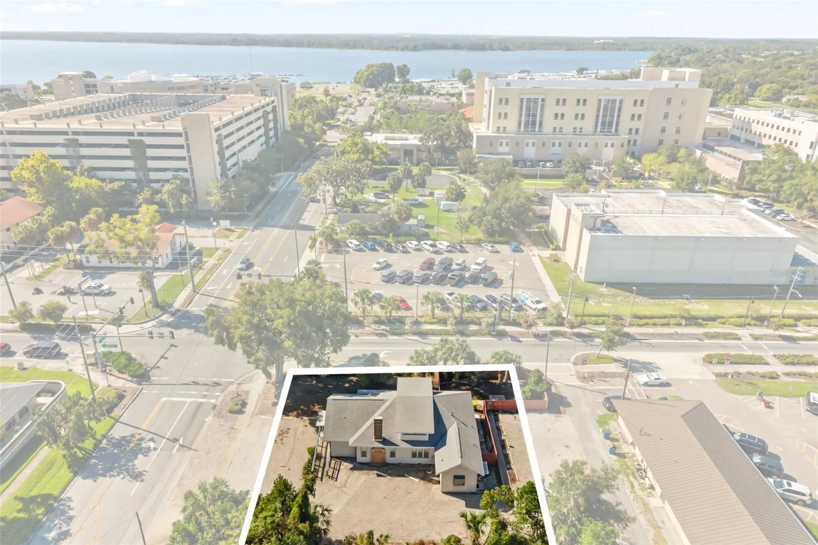 Downtown Tavares, office building front center, courthouse, parking garage and Lake Dora in view