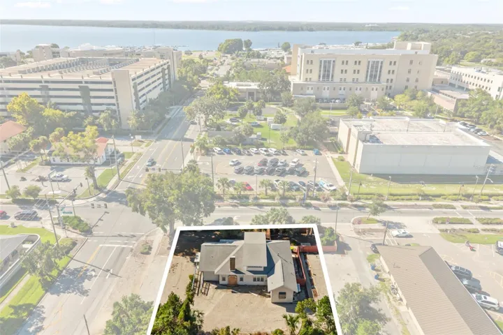 Downtown Tavares, office building front center, courthouse, parking garage and Lake Dora in view