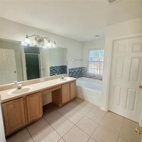 Double sink with tub main bathroom