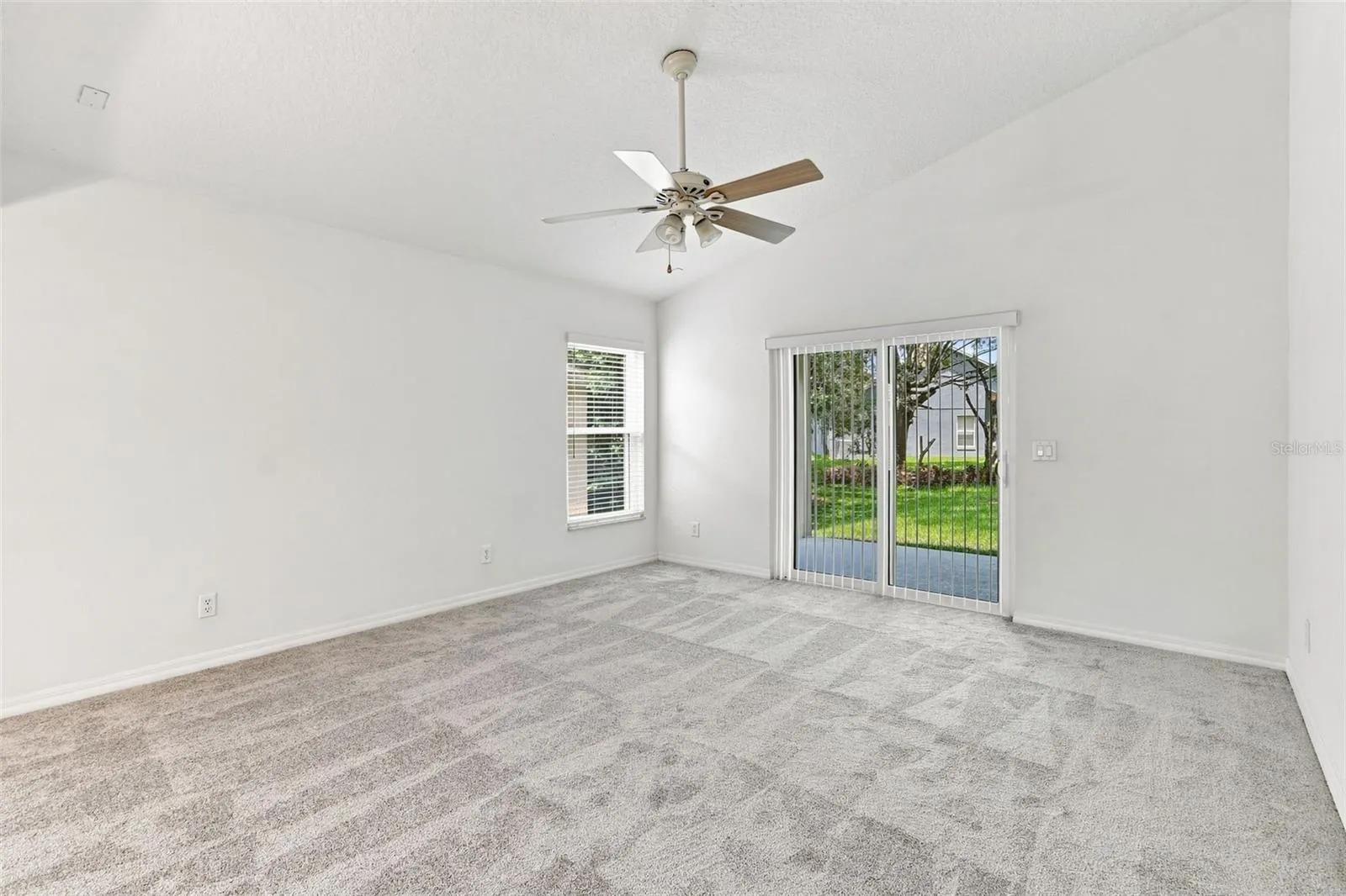 Family Room with Volume Ceilings and Fan