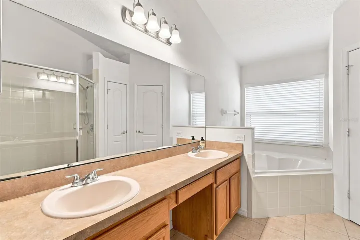 Owner's Bath with Dual Vanities, Separate Shower and Tub