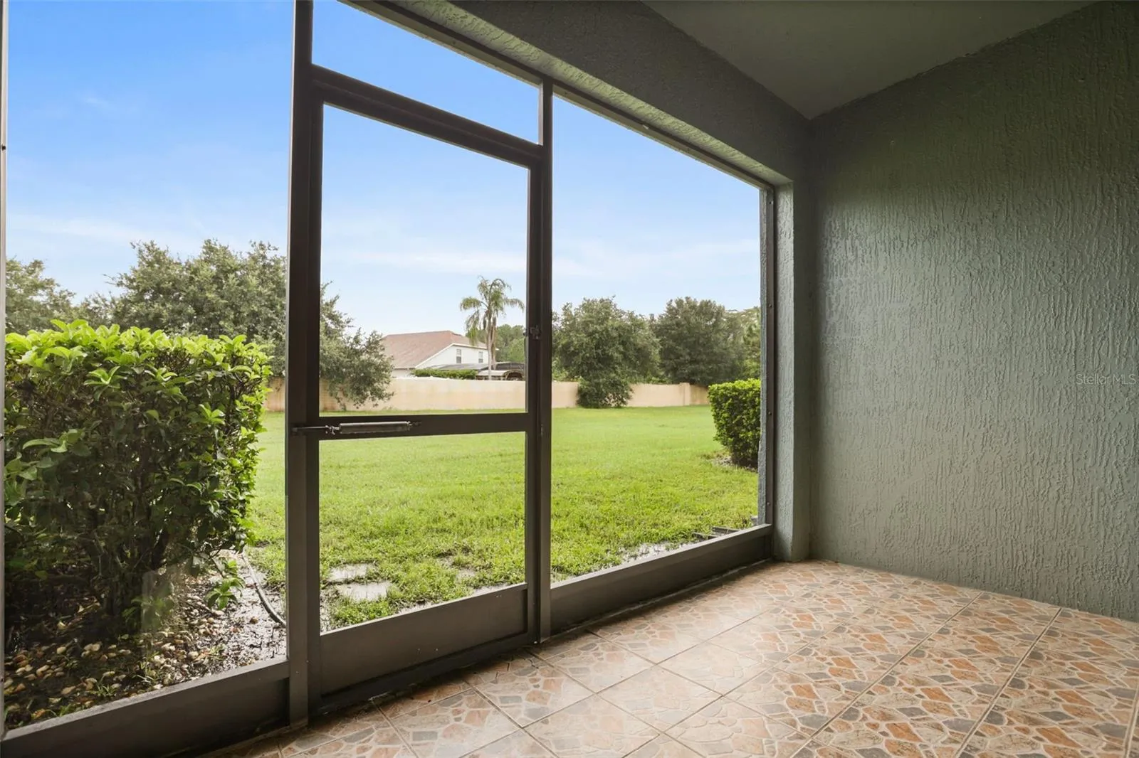 Screened in Porch with Green Space Views