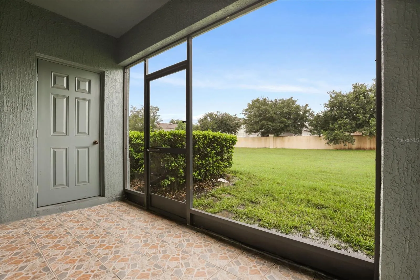 Screened in Patio with Storage Closet