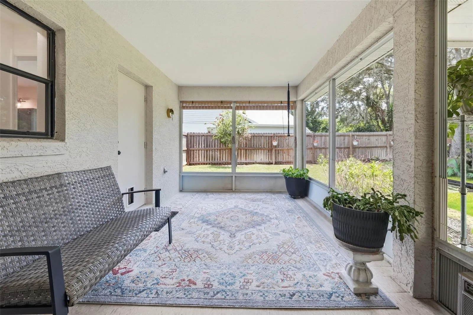 Primary bath door leads to screened patio