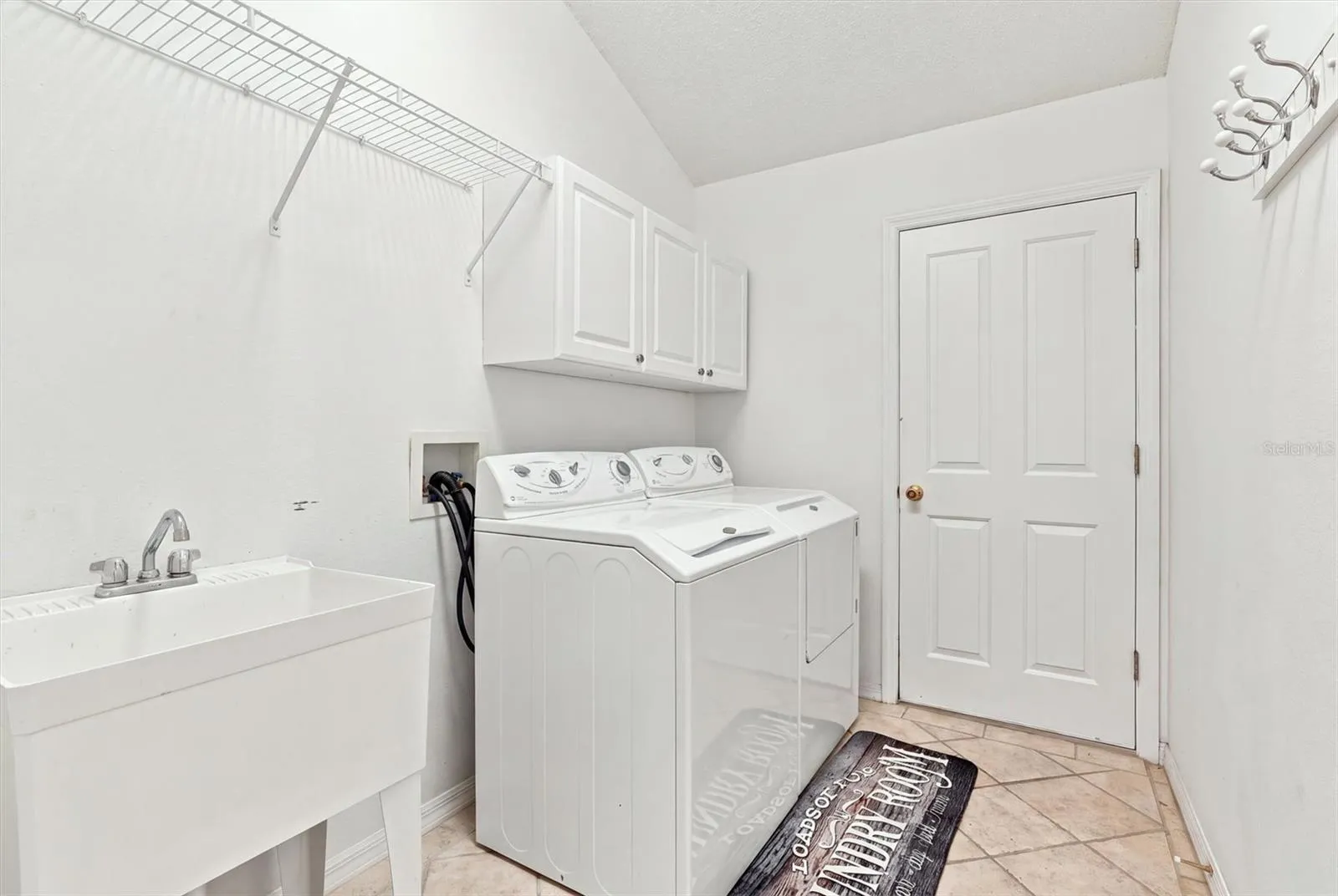 Virtually decluttered - Inside Laundry with Washer & Dryer Included