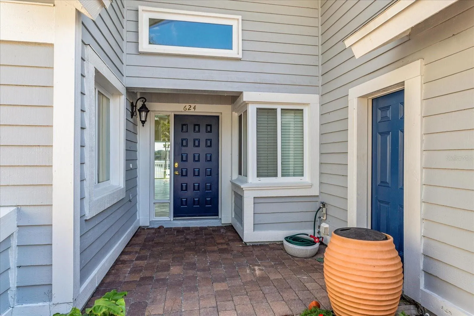 Entry way, home comes with two rain barrels