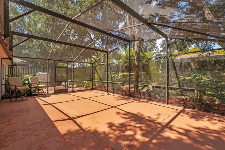 Large Screen Enclosed Patio with view of backyeard