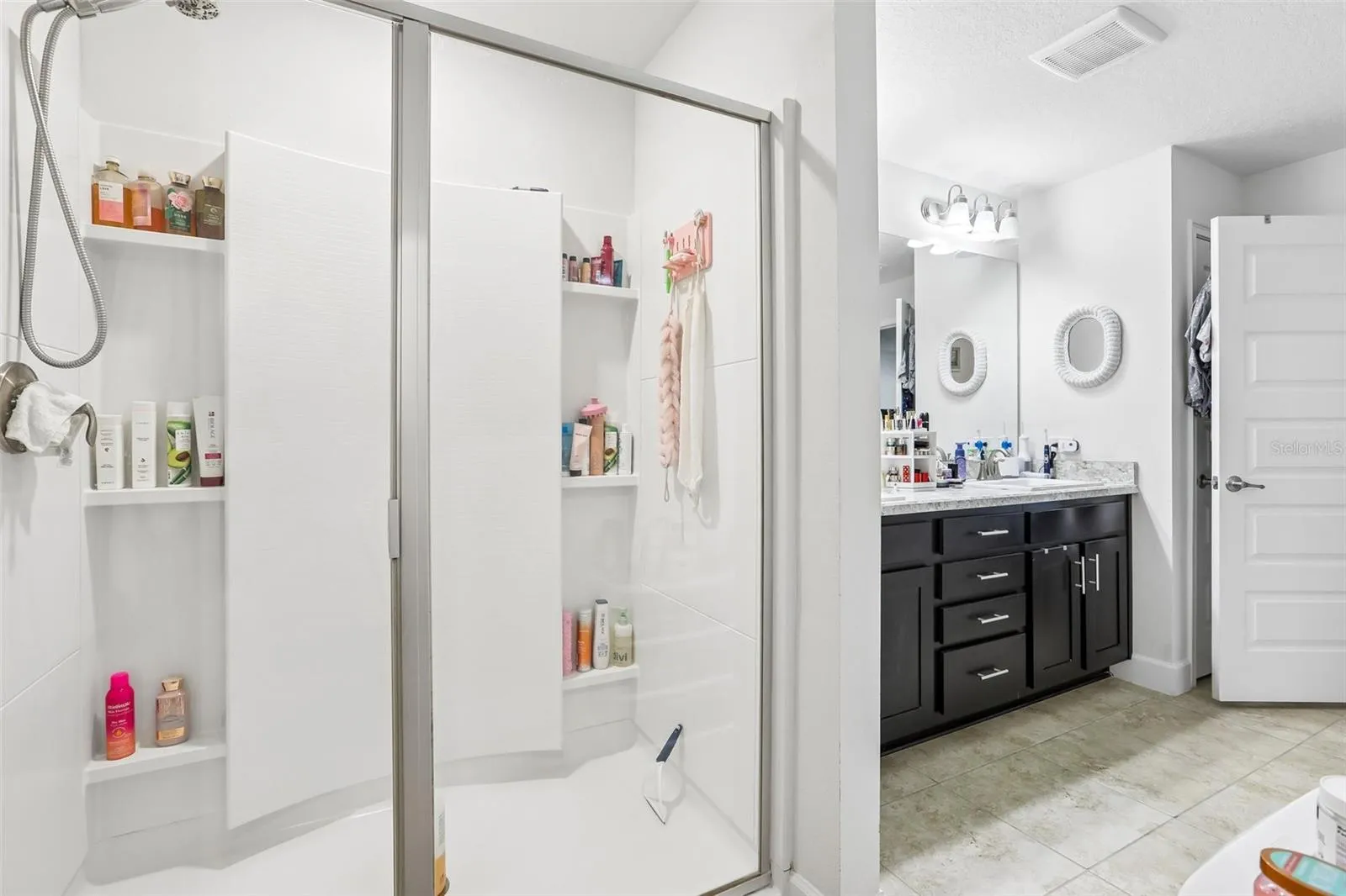 Glass walk-in shower inside master bathroom