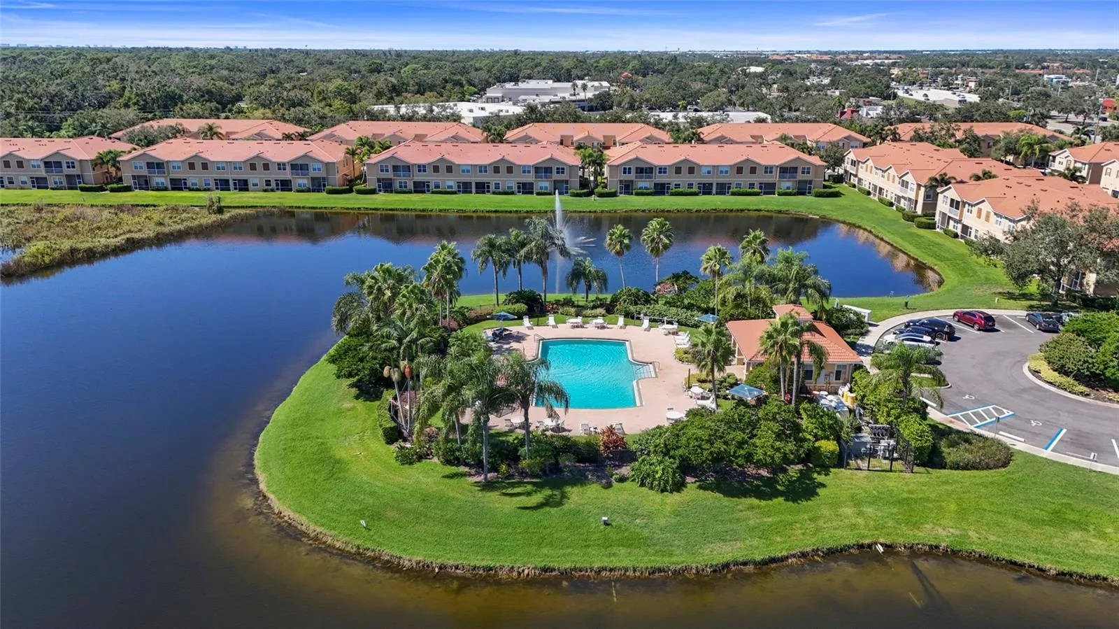 Community pool and clubhouse by the lake