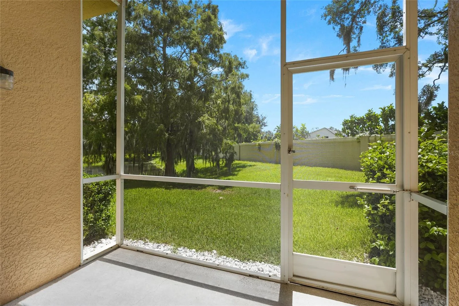 Screened lanai with storage, and pond view