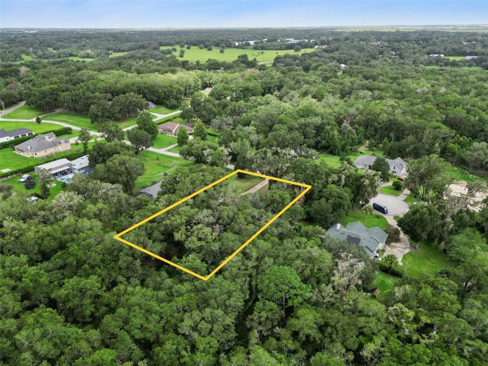 Wide aerial view highlights the property’s country setting while remaining convenient to Mount Dora and the Kelly Park corridor.