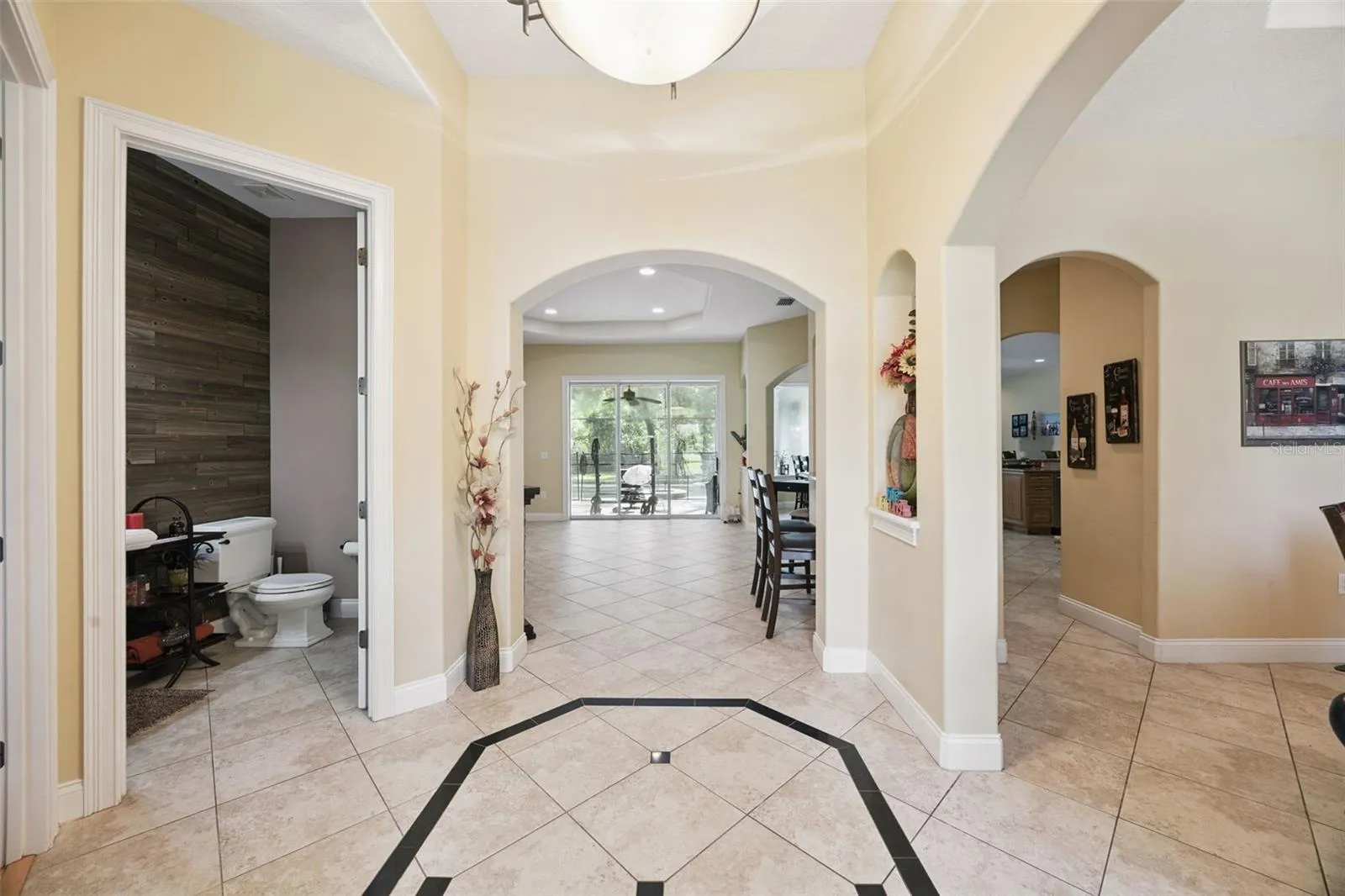 The entry provides separation while maintaining a long sightline through the main living areas.
