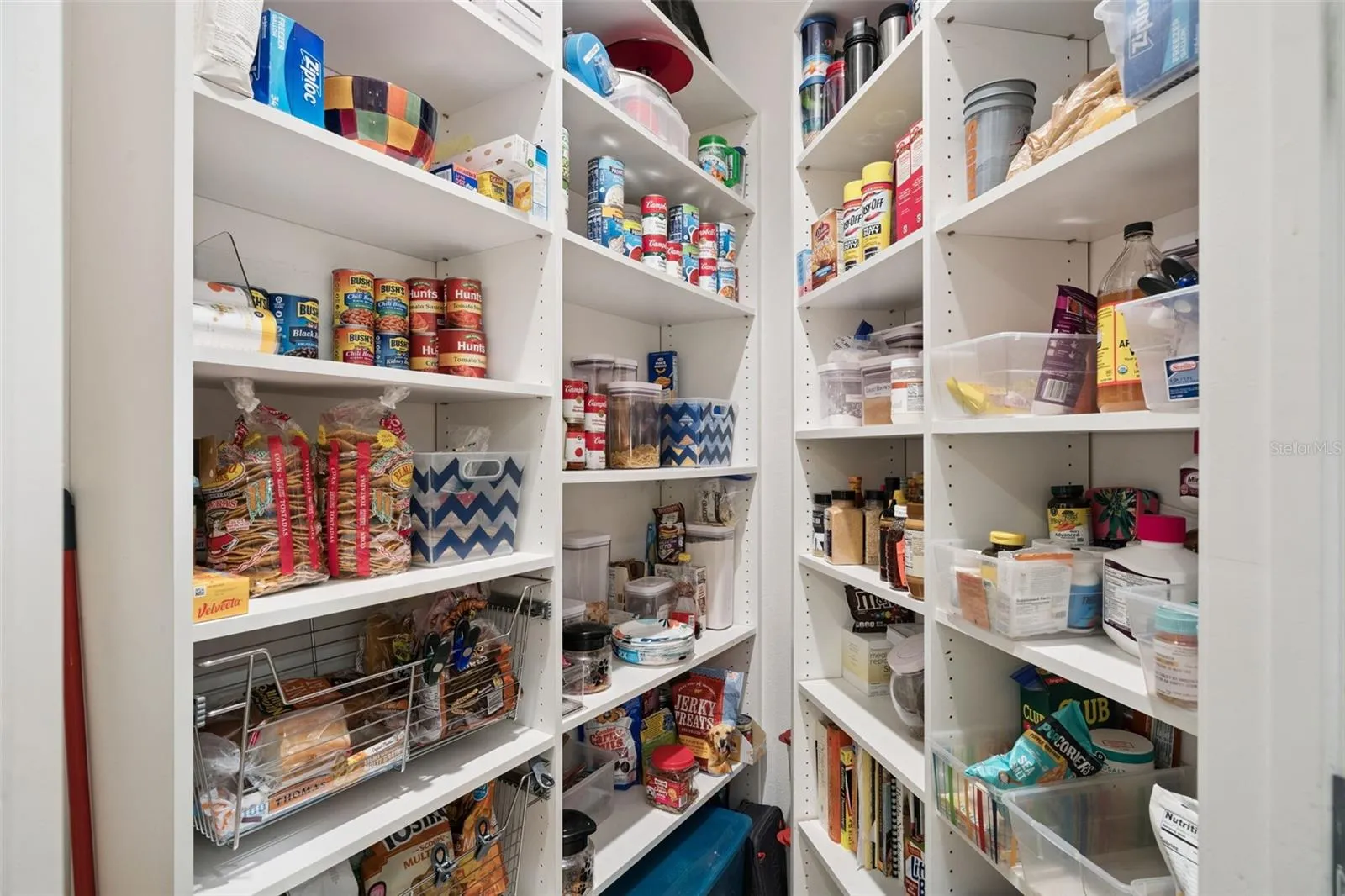 Walk-in pantry provides exceptional storage just steps from the kitchen.