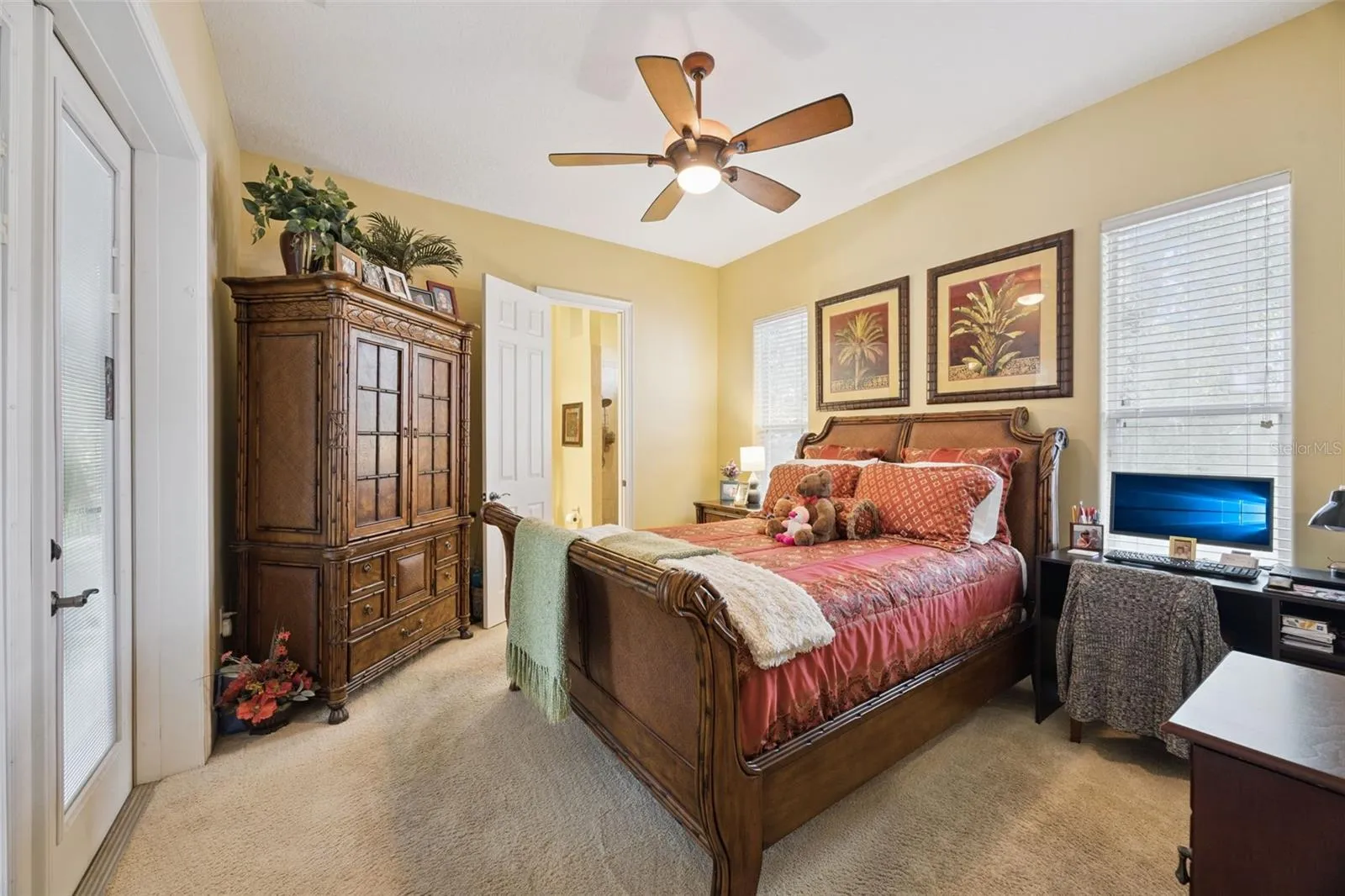 Secondary bedroom suite offers privacy for guests or multigenerational living.