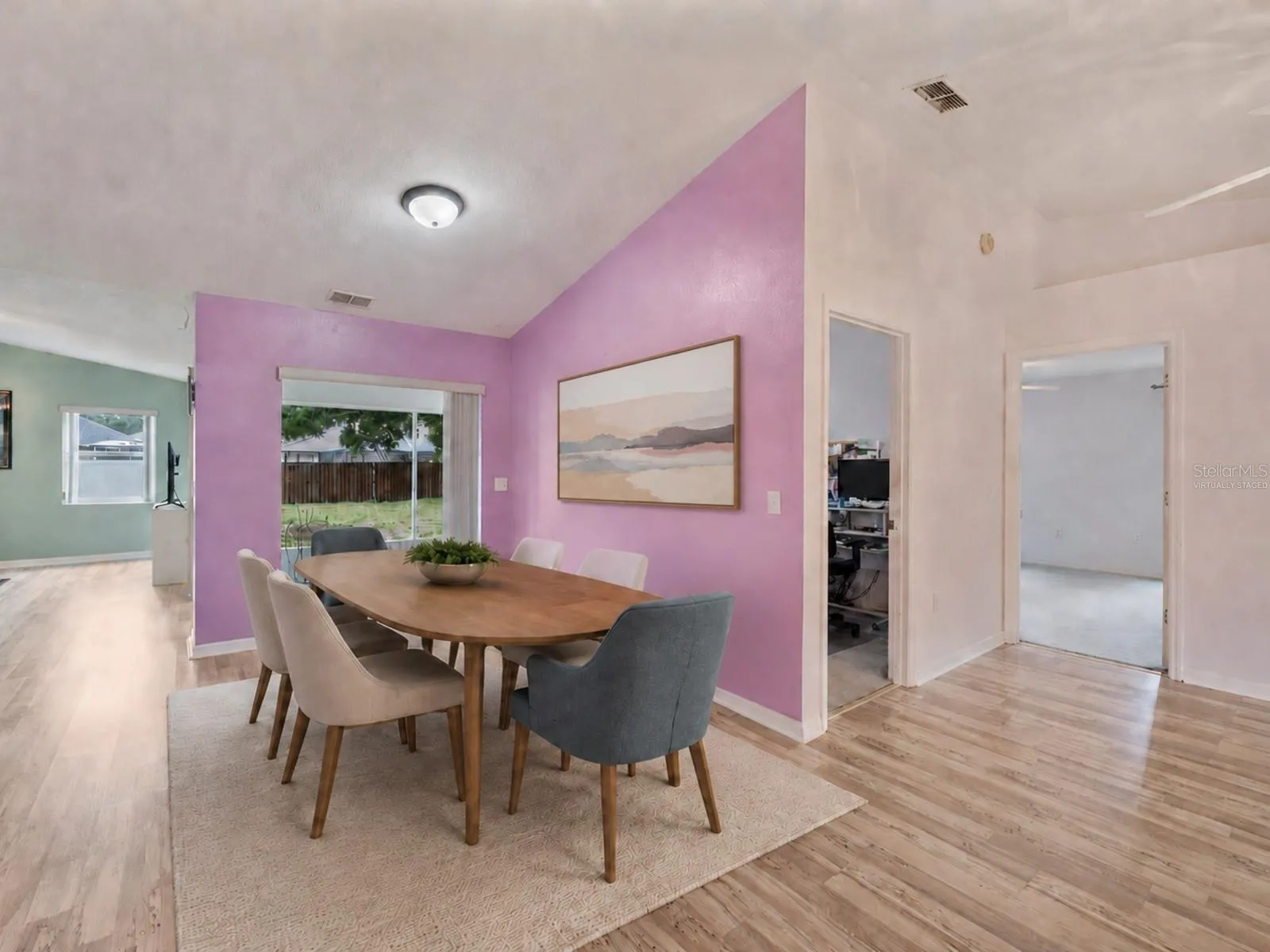 Dining area, open ip to the lanai - Virtually Staged to enhance experience.