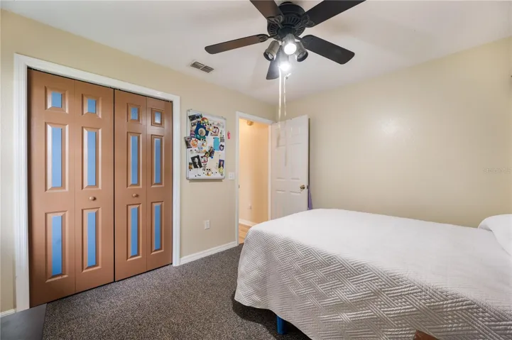 Guest Bedroom 2, carpeted, built in closet