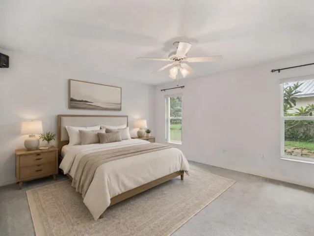 Primary bedroom with walk in closet and en suite - Virtually Staged to enhance experience.